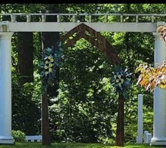 set of two sola wooden arch wedding flowers. sunflowers, blue and black roses .