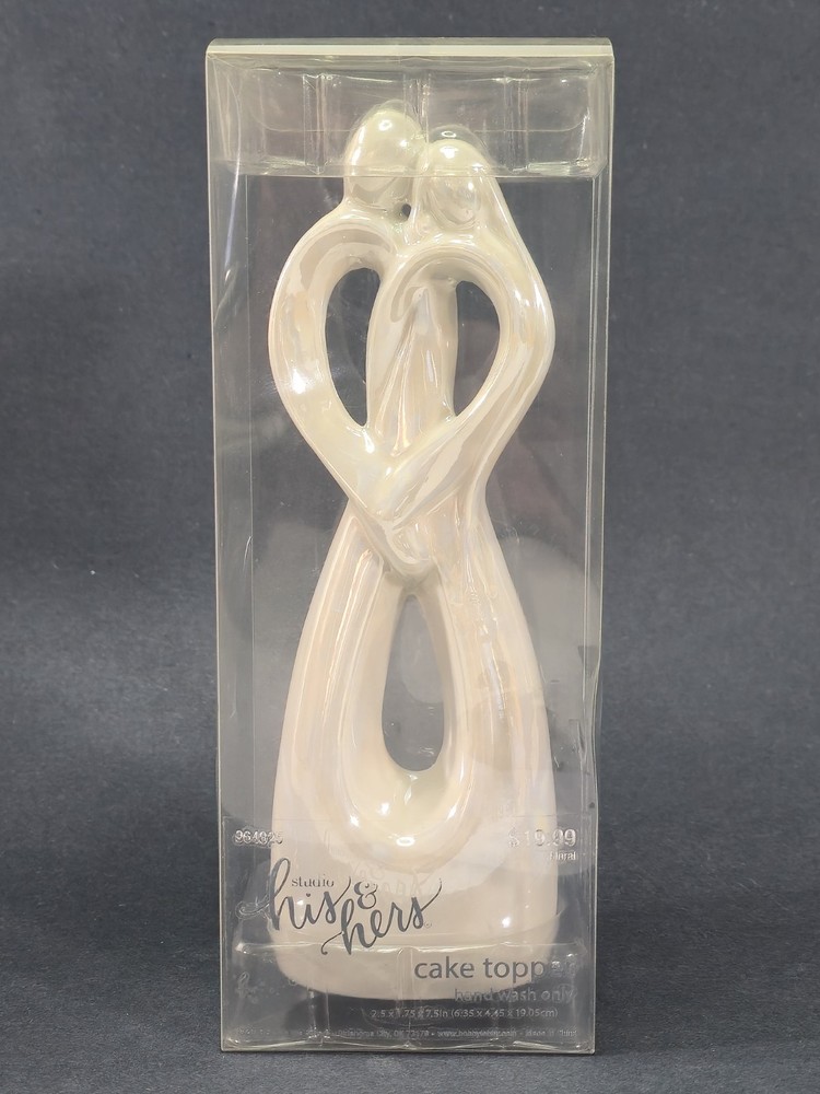 Studio His & Hers 7.5″ Ceramic Cake Topper Man & Woman Holding Each Other Heart