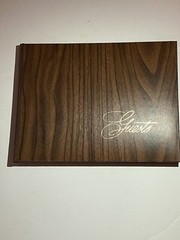Beautiful guest book with wood vinyl wood print cover “guests” In gold cursive.