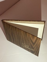 Beautiful guest book with wood vinyl wood print cover “guests” In gold cursive.