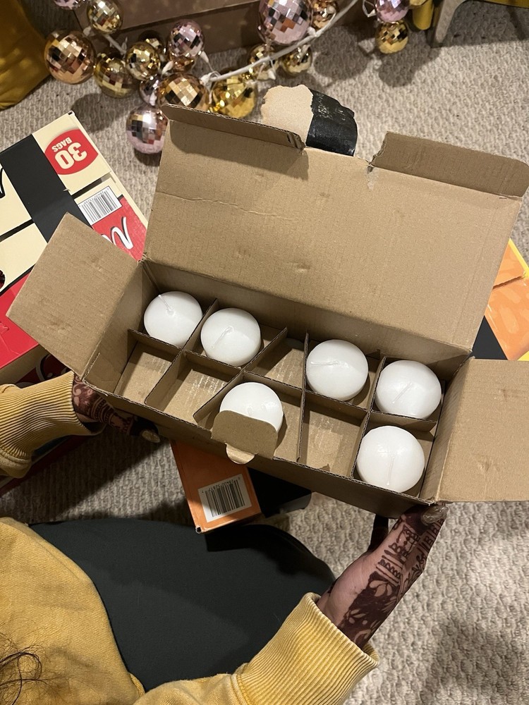 Bulk floating votive candles and holders