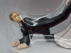 Humorous Leg-Pulling Bride With Groom Resin Wedding Cake Topper