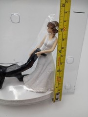 Humorous Leg-Pulling Bride With Groom Resin Wedding Cake Topper
