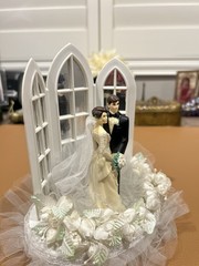 Wilton «Dedication» Wedding Cake Top, Black coat, black pants.