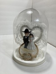 western style wedding cake topper ceramic figures in dome