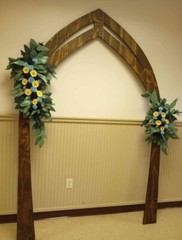 set of two sola wooden arch wedding flowers. sunflowers, blue and black roses .