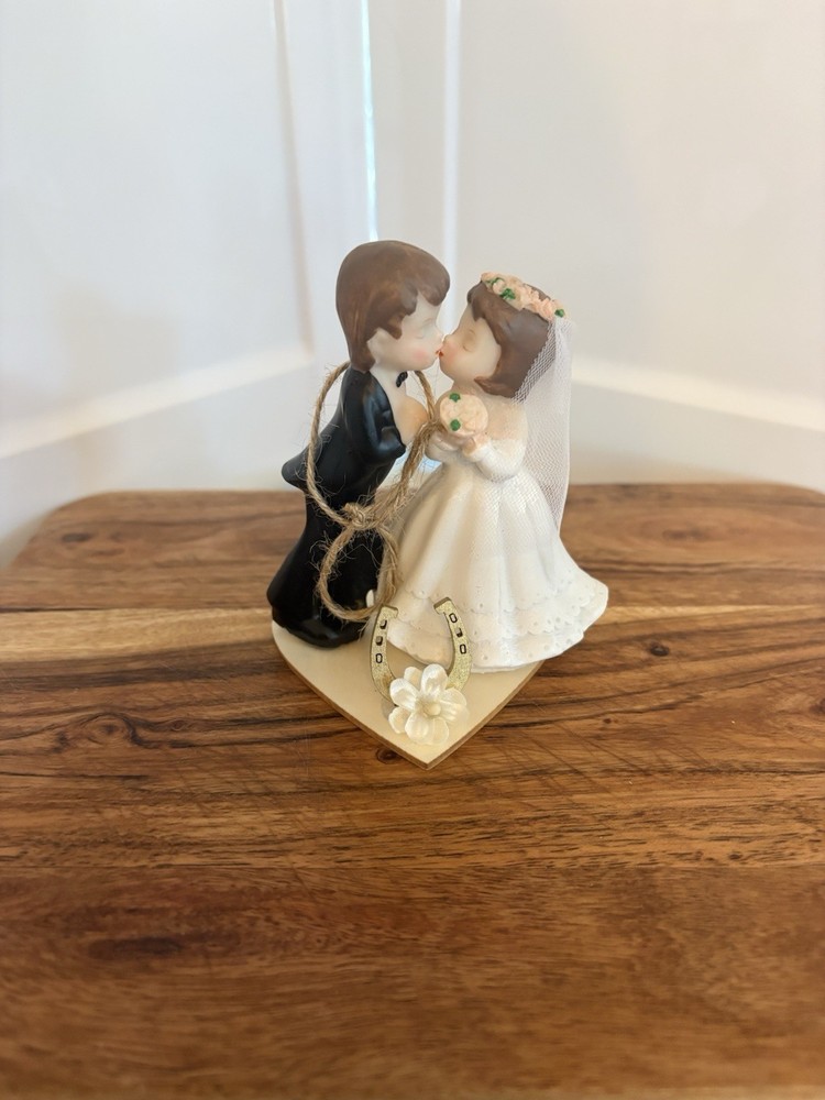 figurine is the «Kissing Couple» Western Wedding Cake Topper