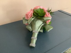 Artificial succulents and pink champagne roses wedding bouquet
