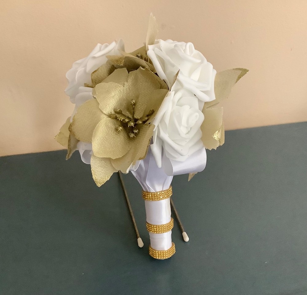 Gold poinsettia and rose wedding bouquet
