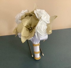 Gold poinsettia and rose wedding bouquet